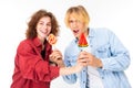 Portrait of lovers girl and guy with candy on a white background