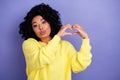 Portrait of lovey flirty girl with chevelure wear knit pullover showing you heart gesture kissing  on purple Royalty Free Stock Photo