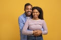 Portrait Of Loving Black Man And Woman Embracing And Smiling At Camera Royalty Free Stock Photo