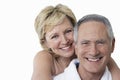 Portrait of loving couple smiling over white background