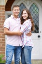 Portrait Of Loving Couple Standing Outside Home Royalty Free Stock Photo