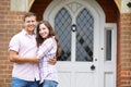 Portrait Of Loving Couple Standing Outside Home Royalty Free Stock Photo