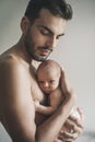 Portrait of loving father with baby at home. Sepia Toned Royalty Free Stock Photo