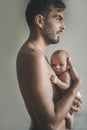 Portrait of loving father with baby at home. Sepia Toned Royalty Free Stock Photo