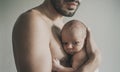 Portrait of loving father with baby at home. Sepia Toned Royalty Free Stock Photo