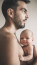 Portrait of loving father with baby at home. Sepia Toned Royalty Free Stock Photo