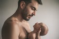 Portrait of loving father with baby at home. Sepia Toned Royalty Free Stock Photo