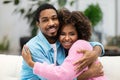 Portrait of loving happy young black couple embracing Royalty Free Stock Photo