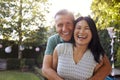 Portrait Of Loving Mature Couple In Back Yard Garden Royalty Free Stock Photo