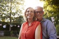 Portrait Of Loving Mature Couple In Back Yard Garden Royalty Free Stock Photo