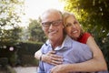 Portrait Of Loving Mature Couple In Back Yard Garden Royalty Free Stock Photo