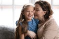 Portrait of small child and old grandmother play at home Royalty Free Stock Photo