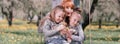 Portrait of loving parents with their three children outdoors Royalty Free Stock Photo