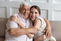 Portrait of loving senior father and adult daughter hugging Royalty Free Stock Photo