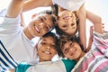 Portrait, low angle and a group of happy siblings or huddled together or hug in solidarity and smiling outdoors. Circle Royalty Free Stock Photo