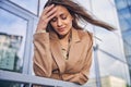 Modern stylish female entrepreneur suffering from a headache