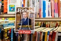 Portrait of LVMH owner Bernard Arnault at press kiosk on Forbes