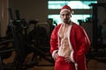 Portrait Of Macho Man In Santa Costume