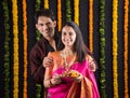 Indian couple with puja / pooja thali