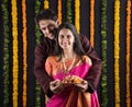 Indian couple with puja / pooja thali