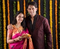 Indian couple with puja / pooja thali