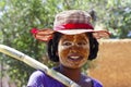 Portrait of malagasy woman with tradytional mask on the face