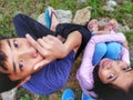 Portrait of Malay sibling enjoing nature viewing at Taman Wetland Putrajaya. Environmental responsibility and nature concept