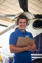 Portrait Of Male Aero Engineer With Clipboard Carrying Out Check Royalty Free Stock Photo