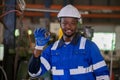 Portrait male african american worker happy smiling wear hardhat standing at factory industrial. Engineering worker man work Royalty Free Stock Photo