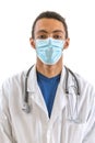 Portrait of male afro american doctor with stethoscope, mask and lab coat. Young doctor looking at camera. Man standing on white Royalty Free Stock Photo