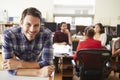 Portrait Of Male Architect With Meeting In Background