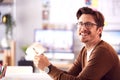 Portrait Of Male Architect In Office Working At Desk With Wooden Model Of Building Royalty Free Stock Photo