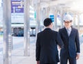 Portrait of male architect with safety hardhat greeting his partner. Young man builder showing handshake. Partnership concept.team