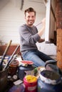 Portrait Of Male Artist Working On Painting In Studio Royalty Free Stock Photo