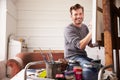Portrait Of Male Artist Working On Painting In Studio Royalty Free Stock Photo