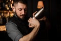 Portrait of male bartender with shaker in his hands