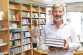 Portrait Of Male Bookstore Owner With Customer In Background Royalty Free Stock Photo