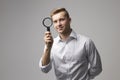 Portrait Of Male Criminologist With Magnifying Glass