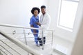 Portrait Of Male Doctor And Female Nurse With Digital Tablet On Stairs In Hospital Royalty Free Stock Photo