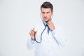 Portrait of a male doctor holding stethoscope Royalty Free Stock Photo