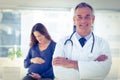 Portrait of male doctor with pregnant woman at clinic Royalty Free Stock Photo