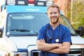 Portrait Of Male Doctor Standing In Front Of Ambulance