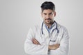 Portrait of male doctor standing at isolated white background Royalty Free Stock Photo