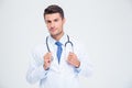 Portrait of a male doctor standing with stethoscope Royalty Free Stock Photo