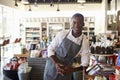 Portrait Of Male Employee Working In Delicatessen