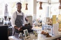 Portrait Of Male Employee Working At Delicatessen Checkout Royalty Free Stock Photo