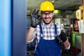 Portrait Of Male Engineer Operating CNC Machinery In Factory Royalty Free Stock Photo