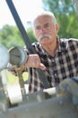 Portrait male engineer working on machine in factory Royalty Free Stock Photo