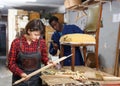 Restorers working with wooden furniture