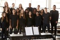 Portrait Of Male And Female Students Singing In Choir With Teacher At Performing Arts School Royalty Free Stock Photo